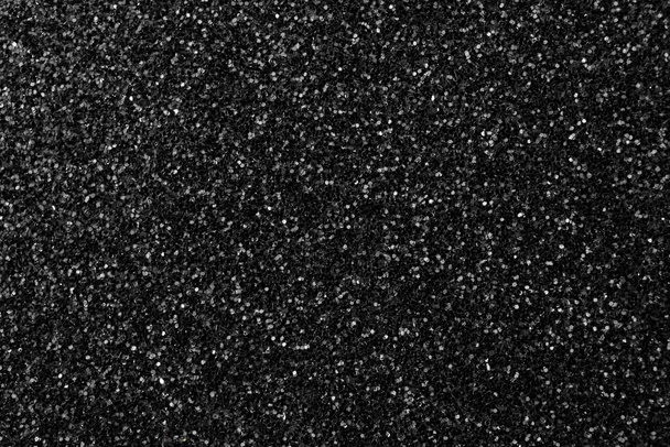 Schwarz glitzernde Textur Hintergrund, Glitter oder Sandpapper hohe detaillierte Oberfläche, leuchtende leuchtende Effekte Konzeptfoto - Foto, Bild