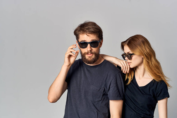 a young couple friendship communication romance wearing sunglasses studio lifestyle - Photo, Image