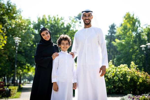 cinematic image of a family from the emirates spending time at the park - Foto, Imagen