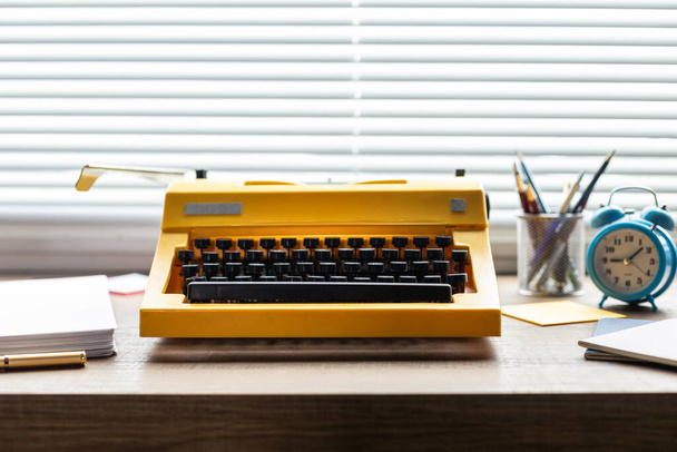 Vintage old typewriter at wood desk table. Writer or study creative concept - Foto, imagen