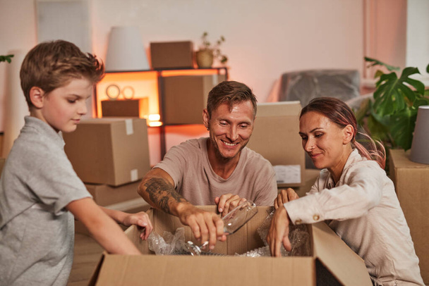 Modern Family Unpacking in New Home - Photo, Image