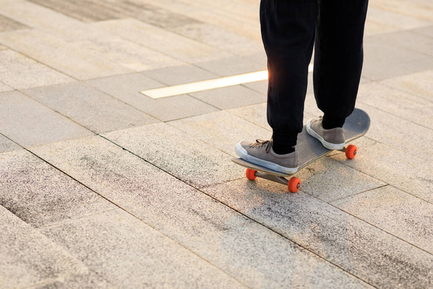 Skateboarder skateboarding outdoors in city - Photo, Image