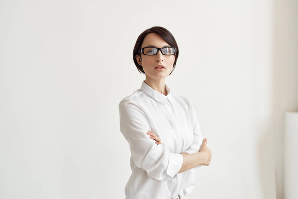Businesswoman with glasses self-confidence light background - Photo, Image