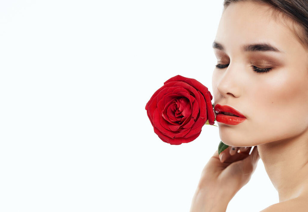 beautiful woman bright makeup rose in hand luxury light background - Foto, Imagen