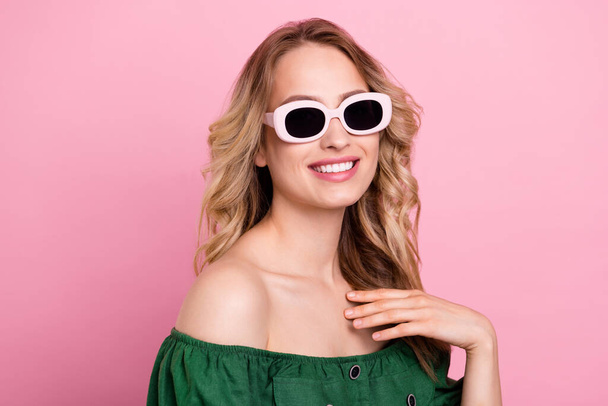Photo of tender beauty tourist lady hand chest wear sunglass bear shoulders green blouse isolated pink color background - Foto, Imagem