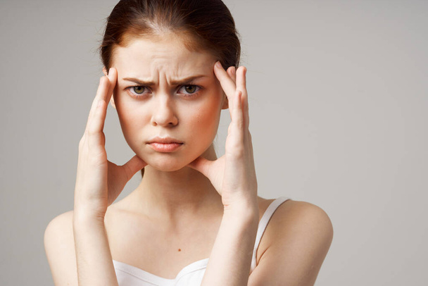 woman with  headache, health problems on  isolated background. High quality photo - Foto, afbeelding