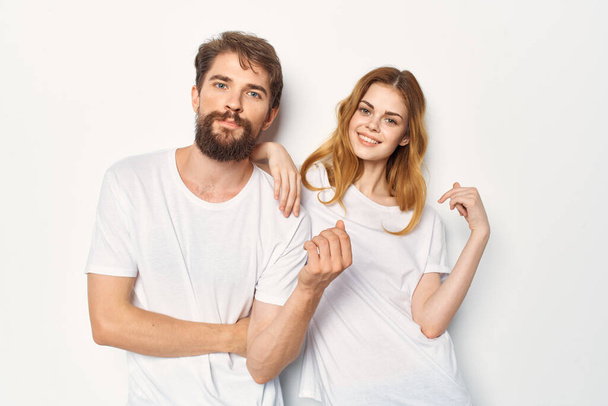 cheerful young couple communication friendship casual clothes light background - Foto, imagen