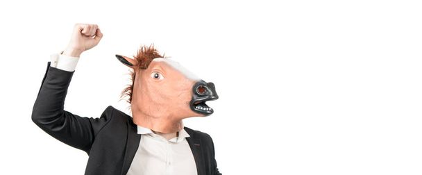 Üzletember a ló fejét maszk emelt ököl erő gesztus, igásló - Fotó, kép