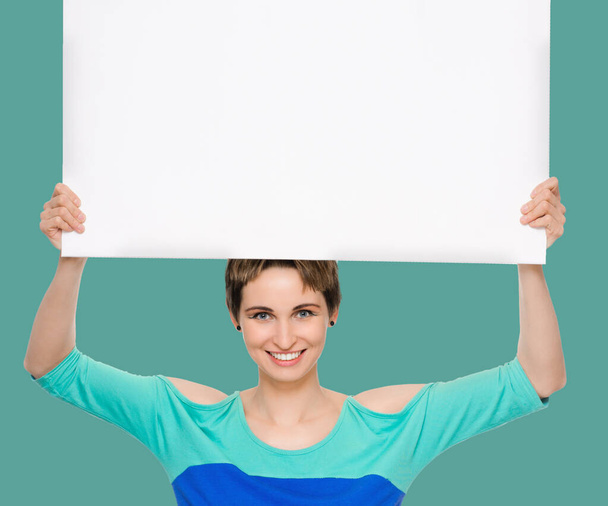 young woman with blank billboard - Foto, Imagen