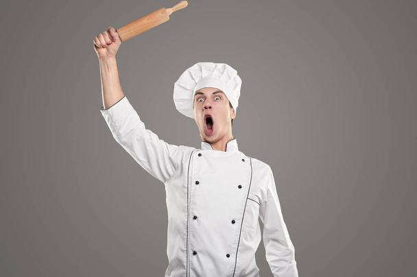 Excited cook with rolling pin - Zdjęcie, obraz