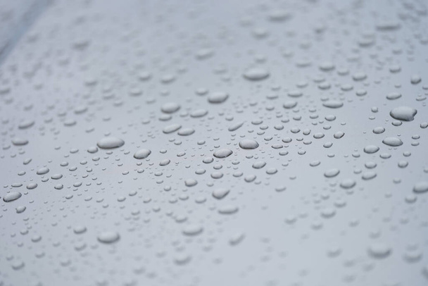 Closeup of drops on dark glass car background - Photo, Image