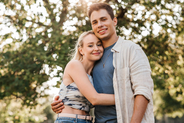 happy young couple hugging outdoors - Valokuva, kuva