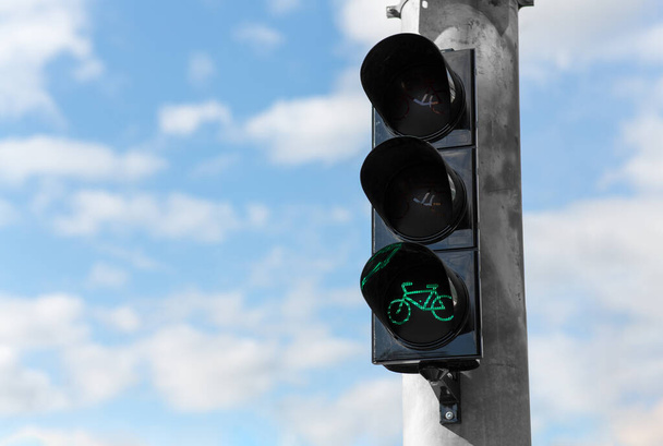 green traffic light for bicycle over blue sky - Photo, image