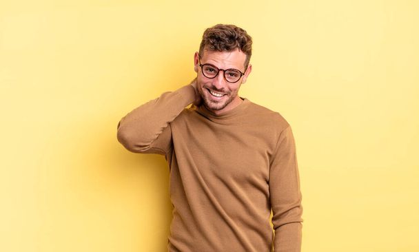 young handsome hispanic man laughing cheerfully and confidently with a casual, happy, friendly smile - Fotoğraf, Görsel