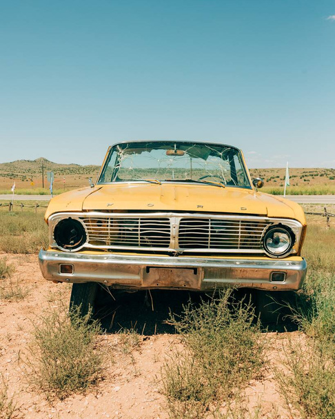Vintage yellow car on Route 66, in Peach Springs, Arizona - Photo, image