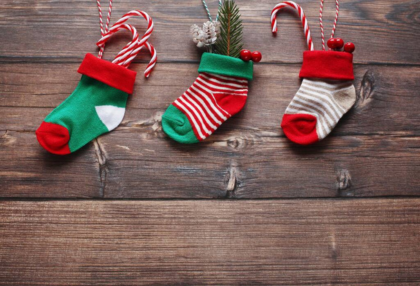 Christmas greeting card template with cute Christmas socks. Flat lay photography.  - Фото, изображение