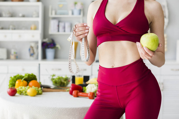 diet concept with sporty woman kitchen 2. High quality beautiful photo concept - 写真・画像