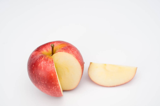 isolated fresh and tasty bio organic apple slice on white background with copy space - Zdjęcie, obraz