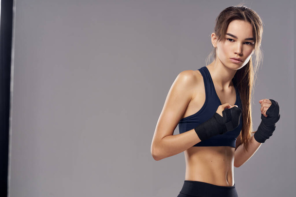 athletic woman hand bandages punch workout fighter isolated background - Foto, imagen