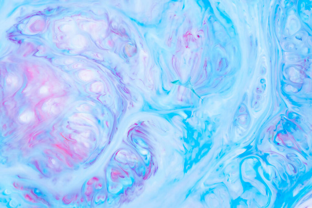 Fluid Art. Abstract liquid paint textured background with decorative spirals and swirls. Liquid pink blue backdrop. Trendy wallpaper - Фото, изображение