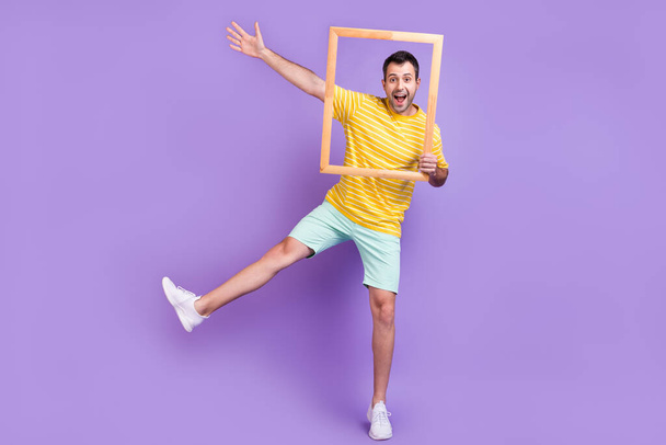 Full size photo of young excited man happy positive smile fooling snapshot frame isolated over violet color background - Fotografie, Obrázek