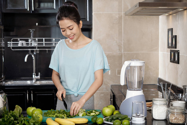 Asian Woman Cooking Salad At Kitchen - Fotografie, Obrázek
