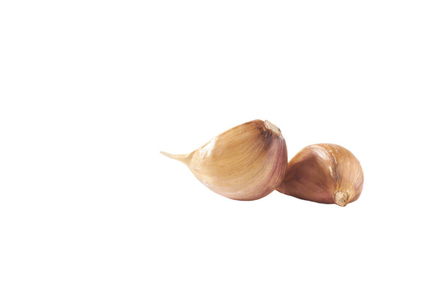 unpeeled cloves garlic isolated on white background, full depth of field. - Photo, Image