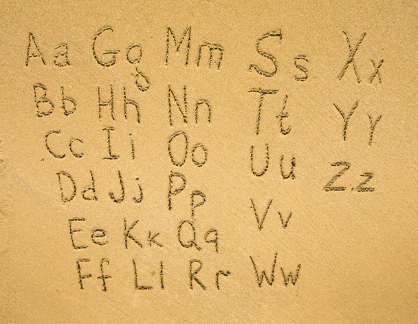 Alphabet written on a sand beach. - Photo, Image