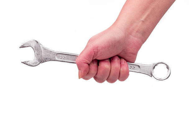 studio lighting. a human hand. wrench on a white background. - Fotoğraf, Görsel