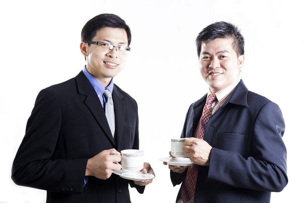 Dos hombres de negocios hablando y bebiendo el café
 - Foto, imagen