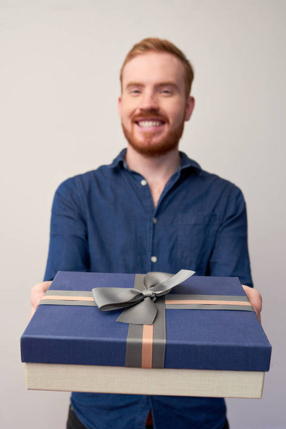 Man Giving Gift To Camera - Photo, Image