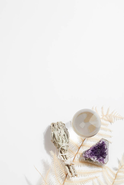 dried sage, fortune telling ball and druse of amethyst on white background.magic rock for ritual, witchcraft, spiritual practice,meditation.copy space - Photo, Image
