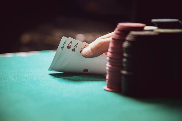 man winning at poker, showing the 4 aces in his hand - Photo, Image