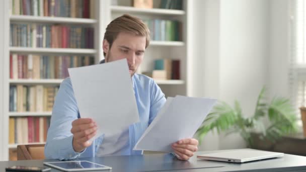 Successful Man Reading Documents at Work - Footage, Video