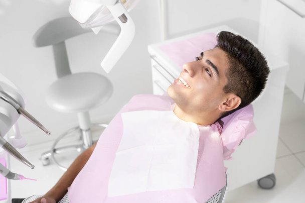 Young Patient in modern dental clinic. - Foto, Bild