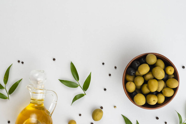 flat lay olives bowl oil bottle. High quality beautiful photo concept - 写真・画像