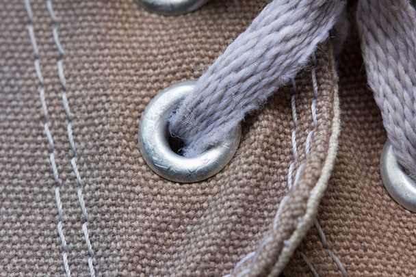 languette d'oeillet de chaussure en toile, avec lacet, gros plan
 - Photo, image