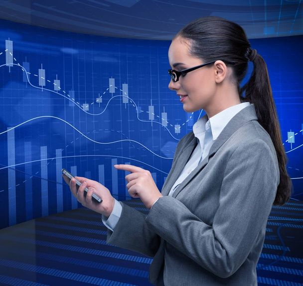 Businesswoman in stock exchange trading concept - Photo, Image