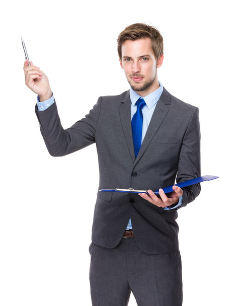 Caucasian businessman with clipboard and pen up - Φωτογραφία, εικόνα