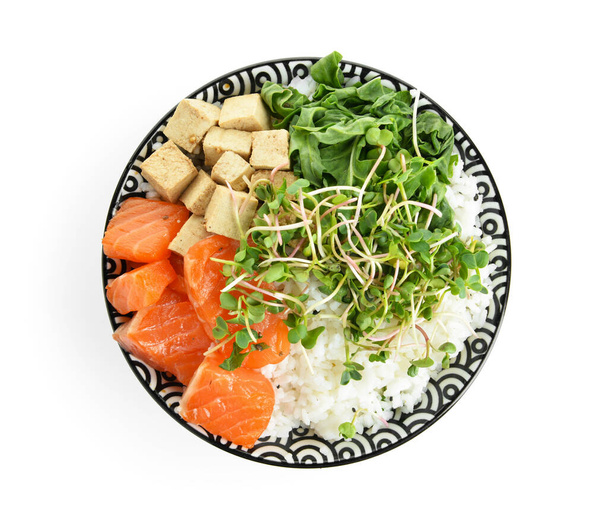 Tasty poke bowl with salmon and tofu cheese on white background - Photo, Image