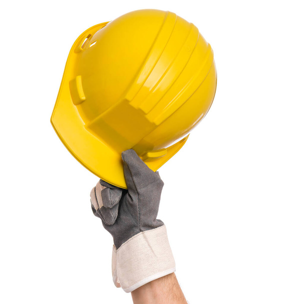 Main masculine portant un gant de travail sur blanc - Photo, image