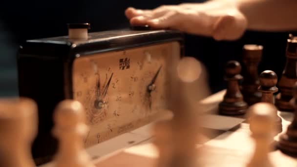 Young people press the chess clock buttons during a game of chess. Close-up - Footage, Video
