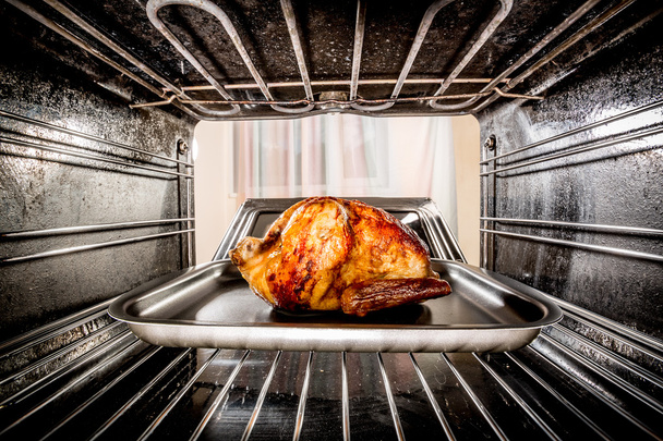 Roast chicken in the oven. - Фото, зображення