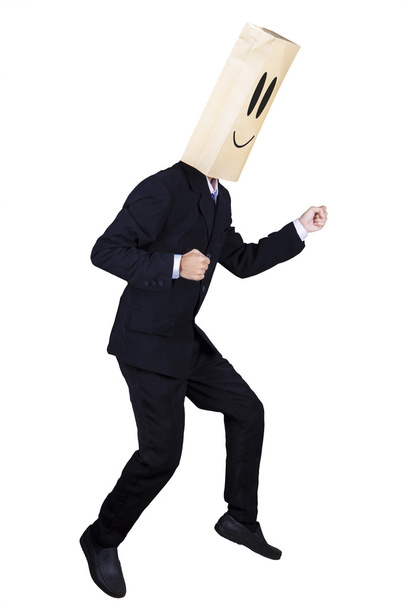 Anonymous businessman with running gesture - Foto, imagen