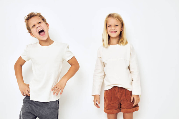 cheerful children dance gesticulate with their hands isolated background - Foto, afbeelding