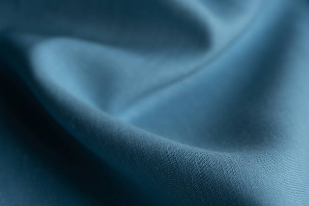 Tessuto di lino, sfondo blu. Tessuto morbido lino blu. Tessuto strutturato sfondo. Macro con dof poco profondo - Foto, immagini