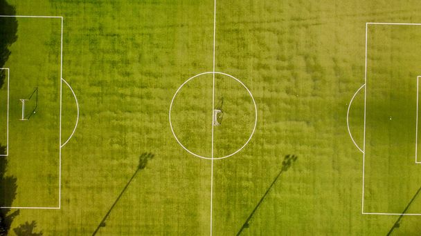 Overhead aerial view of soccer field. Sport concept, outdoor activity and fitness concept. - Photo, Image
