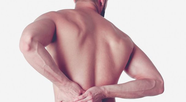 Young man holding his neck in pain. Medical concept - Photo, image