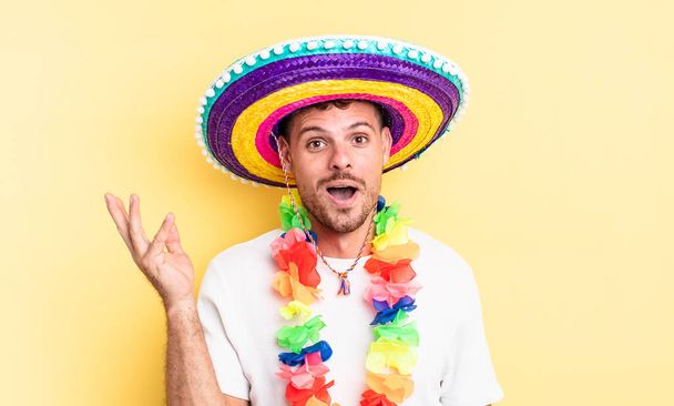 young handsome man feeling happy, surprised realizing a solution or idea. mexican party concept - Photo, Image