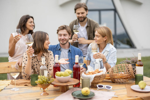 Friends talk and celebrate on friendly picnic - Photo, Image
